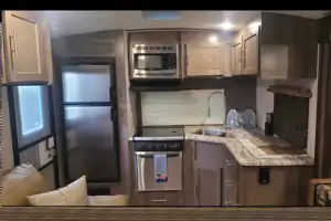 Kim & Scott's Cozy Camper (Forest River Surveyor)
