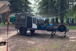 Camo Sunset Park RV Sunray Micro Trailer with toy hauler on front