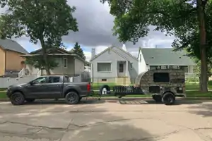 Camo Sunset Park RV Sunray Micro Trailer with toy hauler on front