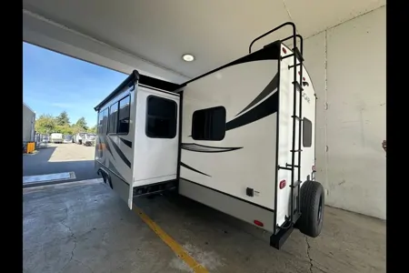 Half ton and family friendly Keystone Cougar 31 BHKWE Travel Trailer