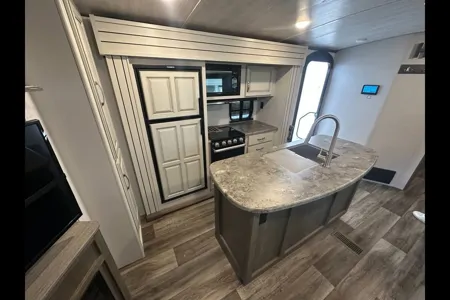 Half ton and family friendly Keystone Cougar 31 BHKWE Travel Trailer