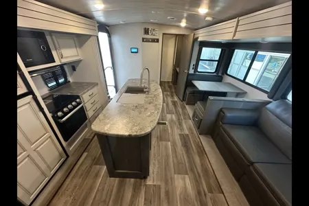 Half ton and family friendly Keystone Cougar 31 BHKWE Travel Trailer