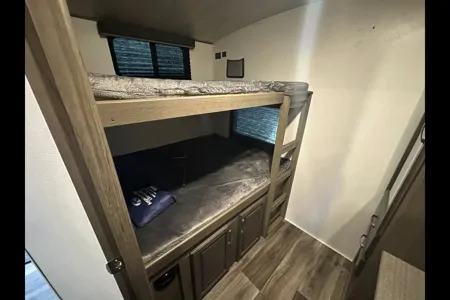 Half ton and family friendly Keystone Cougar 31 BHKWE Travel Trailer