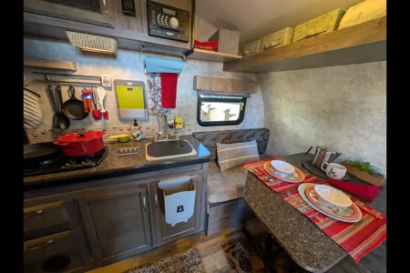 Cozy Red Winnie Drop • Not your typical travel trailer