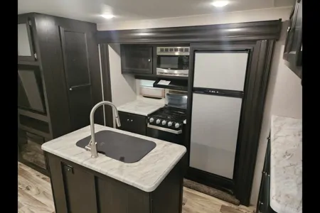 Ray Rays Travel Trailer with outdoor kitchen and bunk room