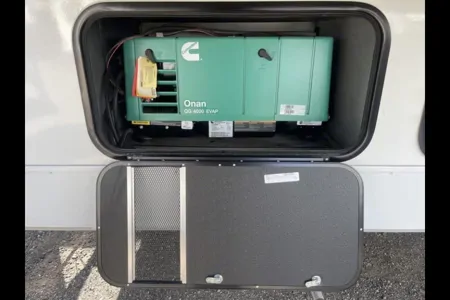 Reyes Family Grand Design Momentum 32G Toy Hauler