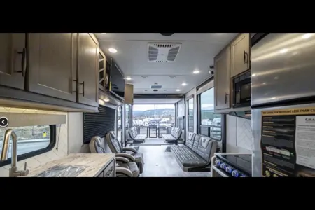 Reyes Family Grand Design Momentum 32G Toy Hauler