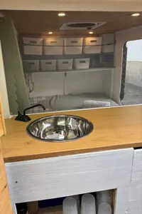Spacious Square-Drop trailer with a small kitchen