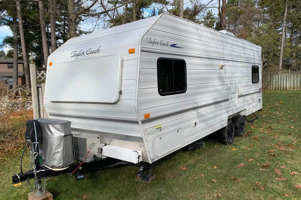 2015 Taylor Coach 24’ Twin Model with double bunks and large bath