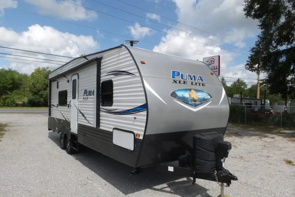 Puma travel trailer in an open lot